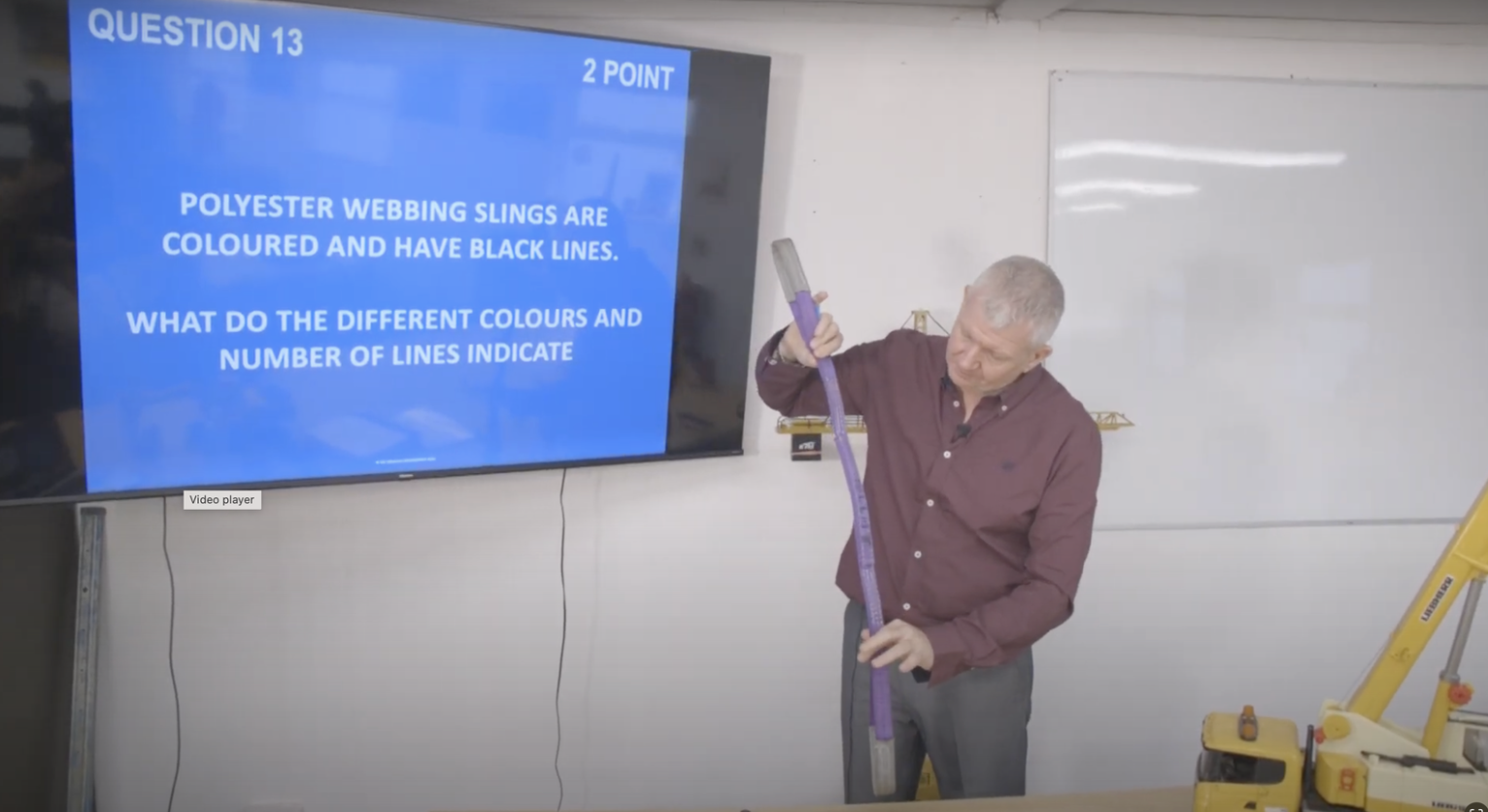 CSCS training instructor demonstrating safety equipment